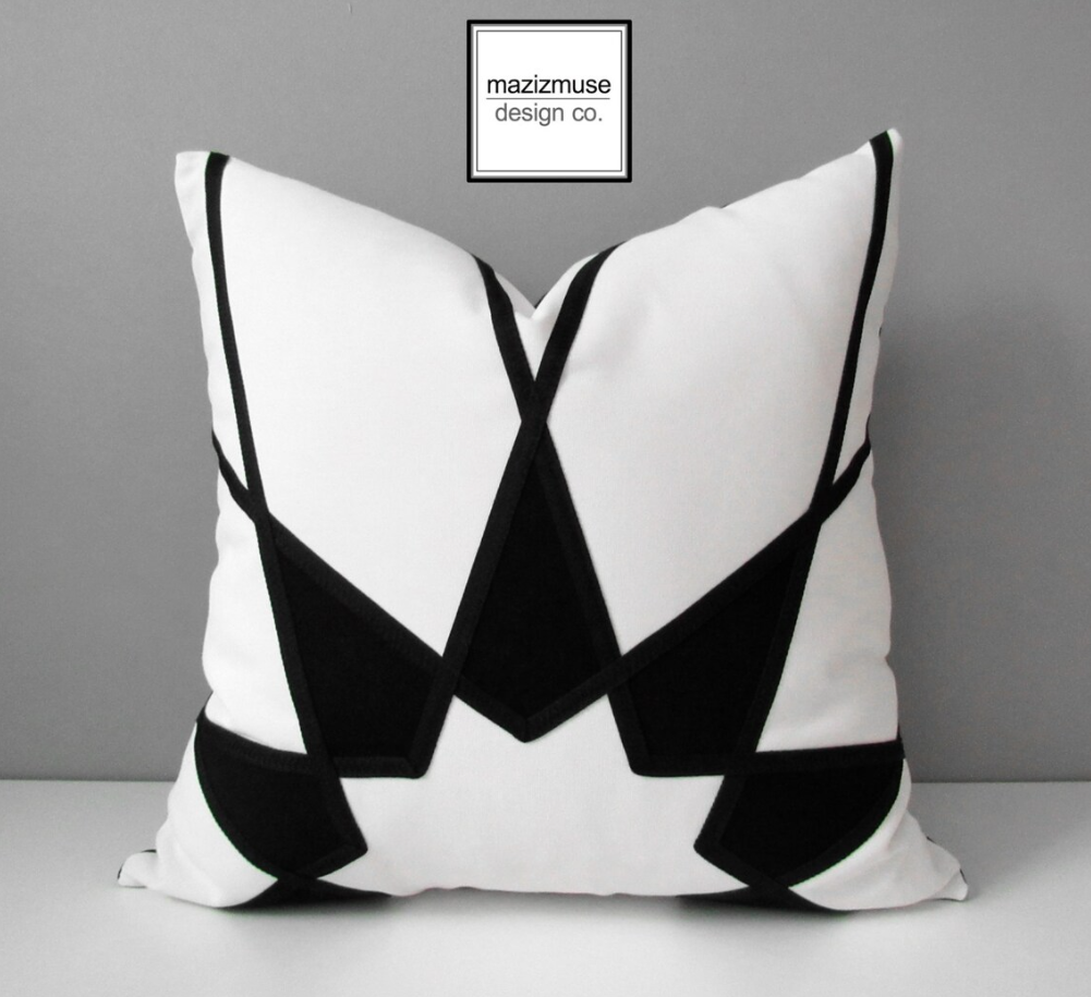 black white sunbrella outdoor pillow with starburst design and art deco style