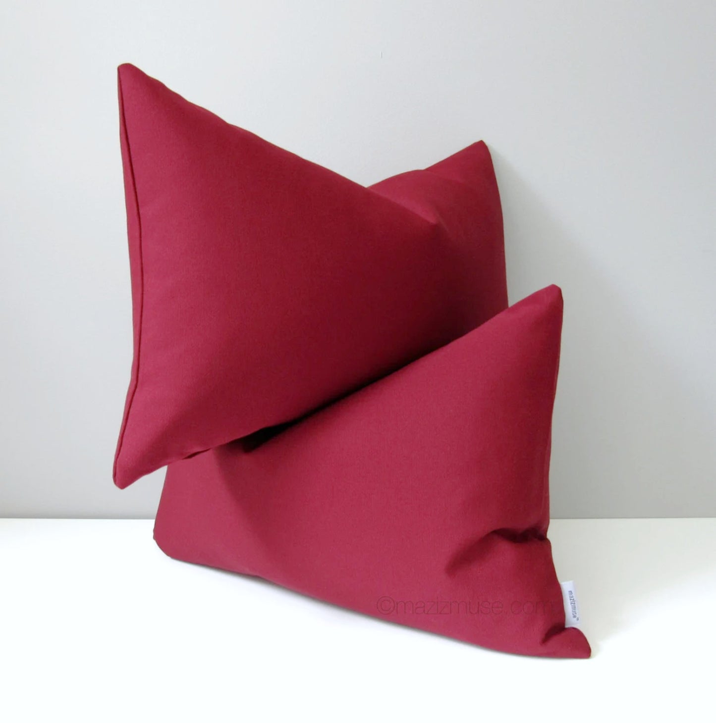 burgundy outdoor pillow in sunbrella fabric for fade and stain resistance
