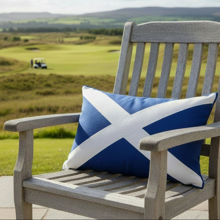 Scotland flag Pillow with a blue and white cross design on a white table
