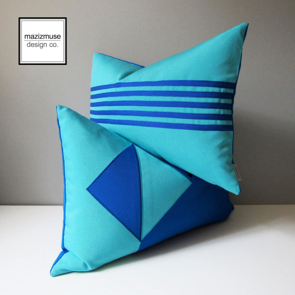 pair of modern outdoor pillows in pacific and aruba blue sunbrella fabric for outdoor seating, decorative blue geoemetric cushions  in lumbar sizes