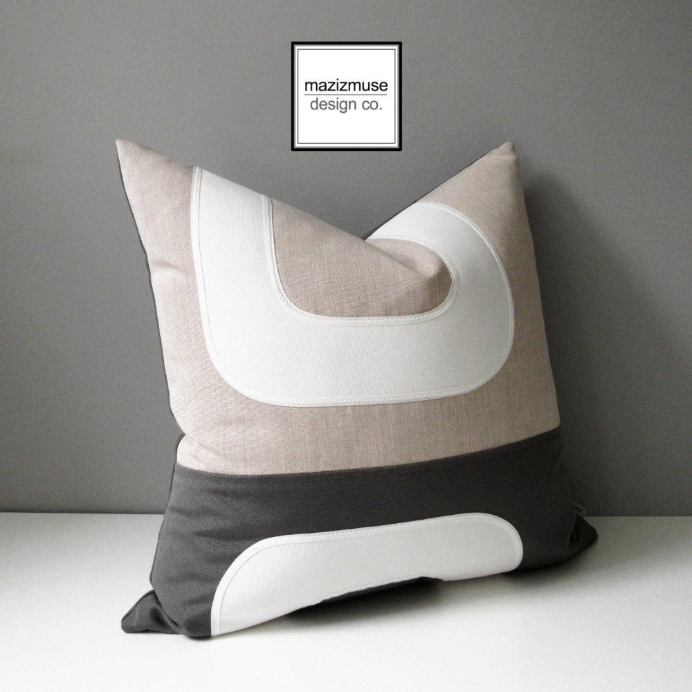 charcoal grey and flax beige sunbrella outdoor pillow cushion in mid century modern design 