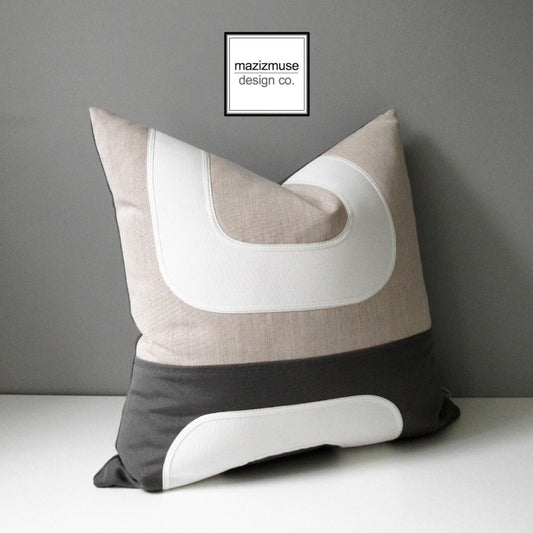 charcoal grey and flax beige sunbrella outdoor pillow cushion in mid century modern design 