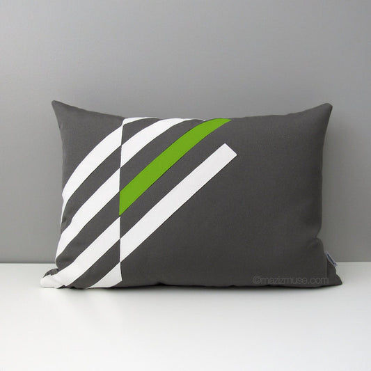 grey and lime green outdoor pillow in geometric design