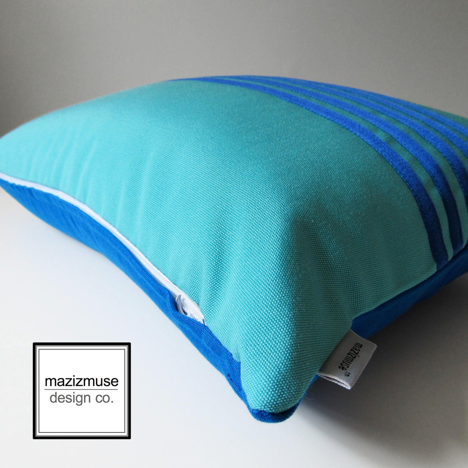 pacific and aruba blue sunbrella outdoo rpillow detail shot of trim stitch and zipper